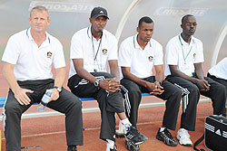 APR head coach Erik Paske (L) flanked by his assistant Eric Nshimiyimana, goalkeeping coach Ramathan Nkunzingoma and team doctor during the Kagame Cup final on Saturday. (Net photo)