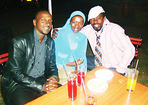 MC Monday (L)shares a light moment with singer, Miss JoJo and her boyfriend (clad in a black leather jacket).