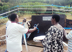 Mayor Yvonne Mutakwasuku commissions the new Nyarucyamo water. (Photo D.Sabiiti)