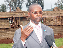 State Minister for Primary and Secondary Education Dr. Mathias Harebamungu infront of a semi completed classrooms built last year. The construction will soon go in phase two (File Photo)