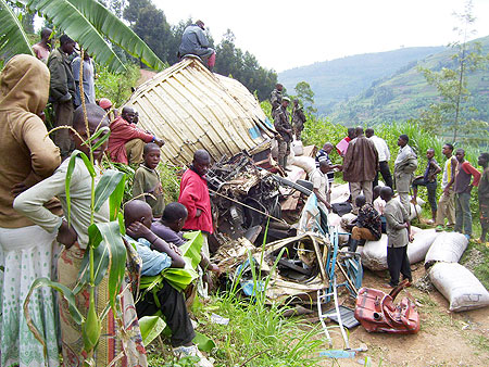 Kigoma residents watching the wreckage of the Fuso truck involved in an accident on Monday. Photo A.Gahene