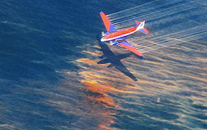 The crew of a Basler BT-67 fixed wing aircraft release oil dispersant over an oil discharge from the mobile offshore drilling unit, Deepwater Horizon, off the shore of Louisiana.