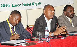 L-R: AMIR Chairman Faustin Zihiga, PS in the Ministry of Agriculture, Ernest Ruzindaza. and  BNR Governor, Francois Kanimba, at the meeting yesterday. (Photo J Mbanda)