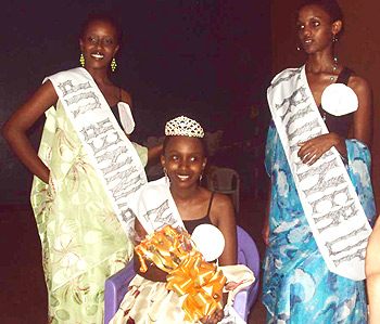 All smiles. Miss Lycee De Kigali 2010 (c) poses for a photo with the 1st (l) and 2nd runner-ups (r)