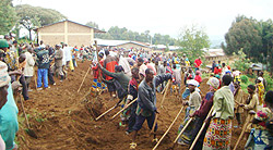 Residents participate in last Saturday Umuganda to clear ground for construction of classrooms under the 9 year basic education programme at Kageyo Secondary School. (Photo: A. Gahene)
