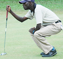 Ruterana calculates one of his putts. He carded an impressive round of 69 to stay in contention of the KCB East African Golf tour. (File Photo)