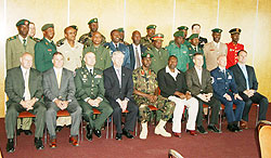 Terrance M. Ford, AFRICOMu2019s J2, in suit, and Col. Dan. Munyuza, RDFu2019s J2 and Director of Millitary Intelligence, in the group photo during the graduation ceremony. (Courtesy photo)
