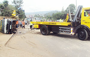 A breakdown pulling up the car which caught fire. (Photo: G. Mugoya)
