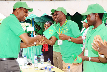  PL President Protais Mitali congratulates the party Presidential candidate Prosper Higiro. (Photo J Mbaanda)