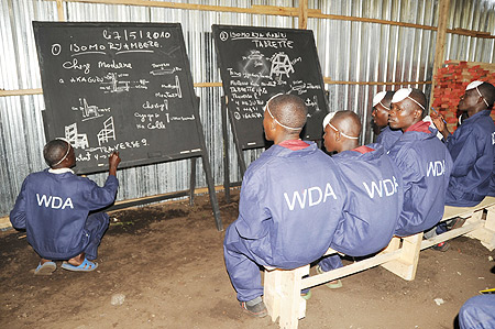 Iwawa trainees in a carpentry instruction class. (Photo: J. Mbanda)
