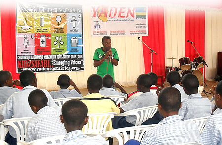 An official from YADEN addresses children during the Kids Safari Festival.