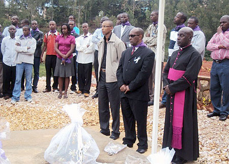 Hon. Jean Thierry Karemera (L) joins Kavumu College students and staff at the genocide commemoration at Kabgayi. (Photo; D. SabiitI)