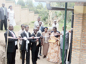 Kamonyi district education officer, Fidu00e8le Uwamahoro, commissions  the new classrooms at GS St. Francis. (Photo: D. Sabiiti)
