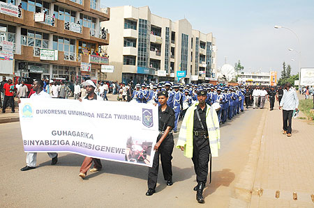 Policemen and women marching during the launch of the National Policeu2019s Hygiene, Road and Environmental safety week in Kigali city (Photo; F. Goodman)