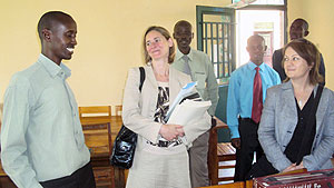 Stephen Rwamurangwa (L) headteacher at Kayonza School chats with Mair Hughes (immediate right) from Bedford in the company of  teachers from both schools. (Photo: S. Rwembeho)