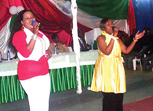 (L-R) Aline Gahongaire and Diana Nkusi performing to Burundians.
