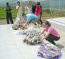   Lt. Col. Diane Ryan (R) laying a wreath on a grave at Murambi Genocide Memorial Centre yesterday