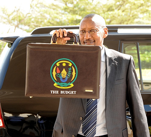 Finance Minister John Rwangombwa arrives at Parliament yesterday to present the 2010-2011 Budget. (Photo J. Mbanda)