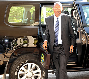 Minister of Finance and Economic Palnning, John Rwangombwa carrying the 2010 Rwanda National Budget (photo / John Mbanda).
