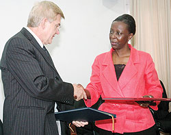 Foreign Affairs, Minister Louise Mushikiwabo, shakes hands with German envoy, Elmar Timpe, after signing the MoU (Photo F Goodman)