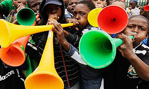  South African boys canu2019t resist the Vuvuzela.