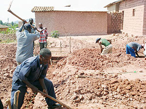 Some of the residents during community work aimed at eliminating grass houses. (Photo: D. Sabiiti)