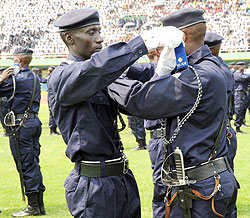 Police cadet officers put on their new pips for the rank of assistant Inspector of Police. (Photo / J. Mbanda).