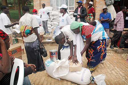 Returnees receive food aid shortly before being dispatched off to their homes last year (File photo).