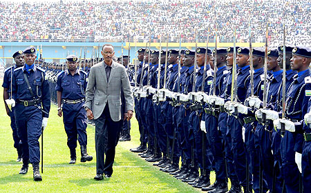 President Kagame inspects a Guard of Honour mounted by the newly promoted Police Cadets yesterday at Amahoro Stadium. 