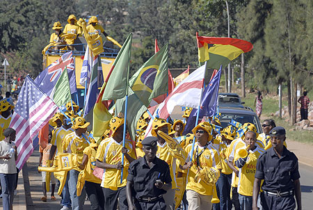 Soccer fans marched to Amahoro carrying flags