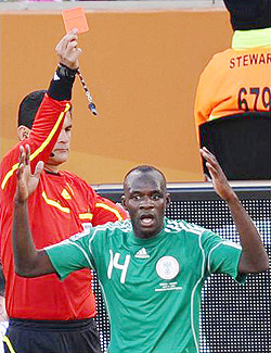 Sani Kaita of Nigeria is shown a red card by referee Oscar Ruiz. 