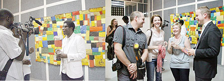 L-R : BEFORE THE CAMERA: Collin Sekajugo in an interview with journalists ; Some of the art lovers, who attended Collinu2019s art exhibition.