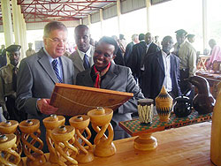 The visiting Dutch minister(R) and the head of Prisons, Mary Gohonzire, admire an art piece made by inmates (Photo; F. Ntawukuriryayo)