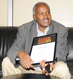Dr.Charles Murigande with the Award Certificate. (Photo; J Mbanda)
