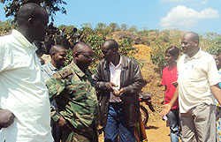 Joseph Sematabaro (Extreme right) with his delegation talking to coffee farmers during the tour (Photo / S. Rwembeho)