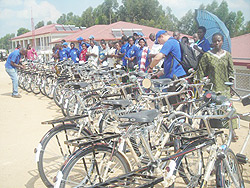 The grassroots mobilisers proudly displaying their donations. (Photo: J.C Gakwaya)