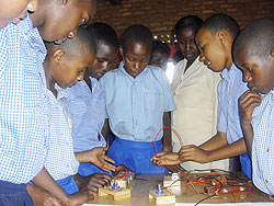 Pupils of Kivugiza primary school  constructing an electric circuit during a practical lesson (Photo. C. Kwizera)