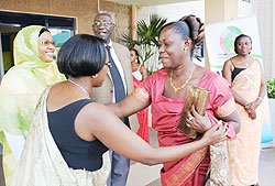 PPC Presidential Candidate, Alivera Mukabaramba, greets Commissioners at NEC. (Photo J Mbanda)