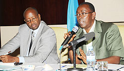 Prime Minister Bernard Makuza (R) speaks at the Central - Local Government meeting as Local Government Minister James Musoni takes notes yesterday. (Photo J Mbanda)