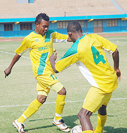 Atraco captain Jean Lomami (L) with a team mate shortly before a Primus League encounter. (File photo)