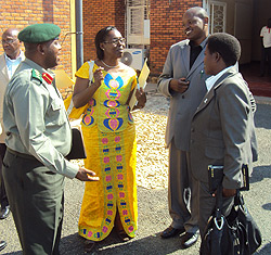 MPs Landrada Umuraza (L), Damien Nyabyenda (C) and Henriette Umurisa chatting with 201 Brigade Commander. (Photo; S. Nkurunziza)