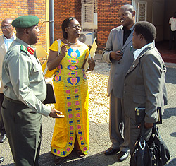 MPs Landrada Umuraza (L), Damien Nyabyenda (C) and Henriette Umurisa chatting with 201 Brigade Commander. (Photo; S. Nkurunziza)