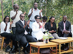 Staff of the Ministry of Finance share a light moment with Imararungu genocide orphans association.photo D.Sabiiti