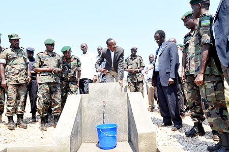 President Paul Kagame commissioning a piped water project constructed during the just concluded Army Week in Muhanga yesterday (Photo / J. Mbanda )