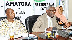 NEC Chairman Chrysologue Karangwa (C) flanked by his vice Fatou Harelimana (R) and Executive Secretary Charles Munyaneza addressing the press yesterday. (Photo J. Mbanda)