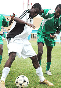 Rassou battles for the ball with SC Kiyovu players. The striker didnot have a good season. (File Photo)