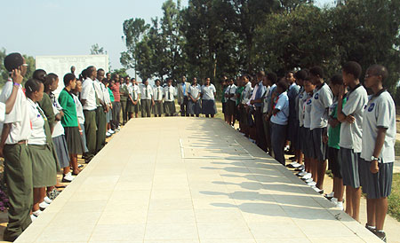 Students of FAWE Girls and Riviera Secondary School acompanied by their teachers, pay respect to genocide victims at Nyanza Memorial site. (Photo G. Mugoya)