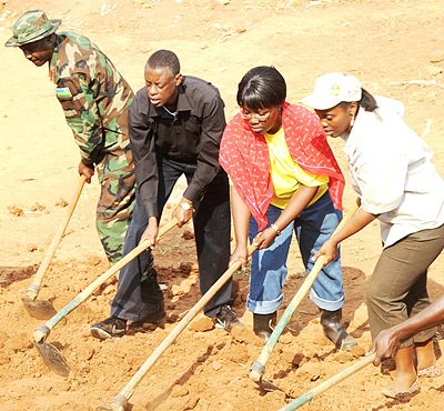 The Minister of Defence Gen. James Kabarebe, president of the National Women Council Dr. D Gashumba and Minister for Gener and Family Promotion. Dr. J Mujawamariya participate in communal work. Photo Goodman.