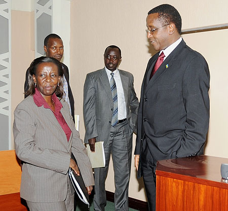 The Minister of Foreign Affairs, Louise Mushikiwabo (L), chats with Senate President, Dr. Vincent Biruta,  yesterday. (Photo: J. Mbanda)