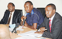 Police Spokesman Supt. Eric Kayiranga (C) with Director General in MININFOR Ignatius Kabagambe (L) and MHC Executive Secretary Patrice Mulama. (Photo J Mbanda)